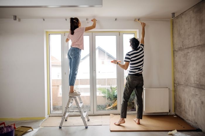 couple fixing the house